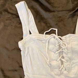 Free People Bodysuit with Lace up top. Size XS.